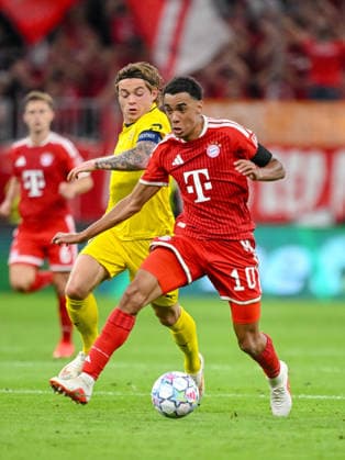 Patrick Berg of FK Bodo Glimt and Jamal Musiala of FC Bayern Munich battle for the ball during the 2026–2027 UEFA Champions League match between Bayern Munich and Bodo Glimt at Fussball Arena Munich on September 10, 2026 in Munich, Germany. Photo by Harry Langer, DeFodi Images