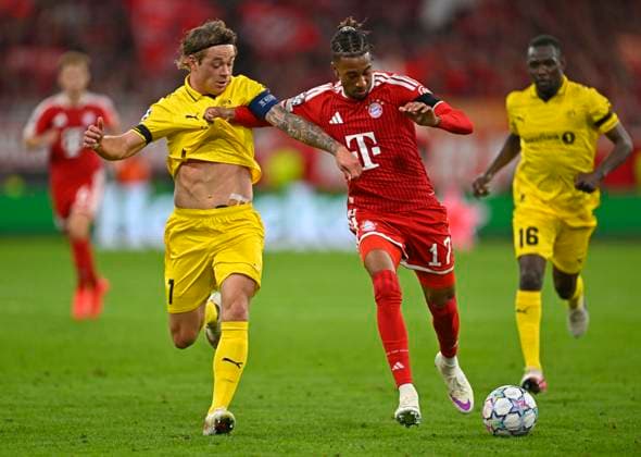 September 10, 2026, Soccer: UEFA Champions League 2026–2027, Matchday 1, FC Bayern Munich vs. FK Bodo Glimt, at the Allianz Arena in Munich; from left: Patrick Berg (FK Bodo Glimt) vs. Michael Olise (FC Bayern Munich)