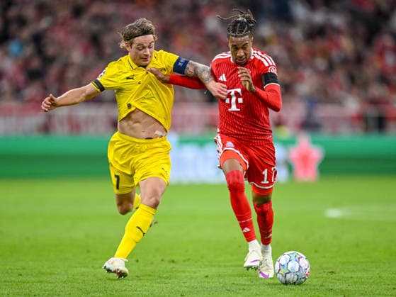 Patrick Berg of FK Bodo Glimt and Michael Olise of FC Bayern Munich battle for the ball during the 2026–2027 UEFA Champions League match between Bayern Munich and Bodo Glimt at Fussball Arena Munich on September 10, 2026 in Munich, Germany. Photo by Harry Langer, DeFodi Images