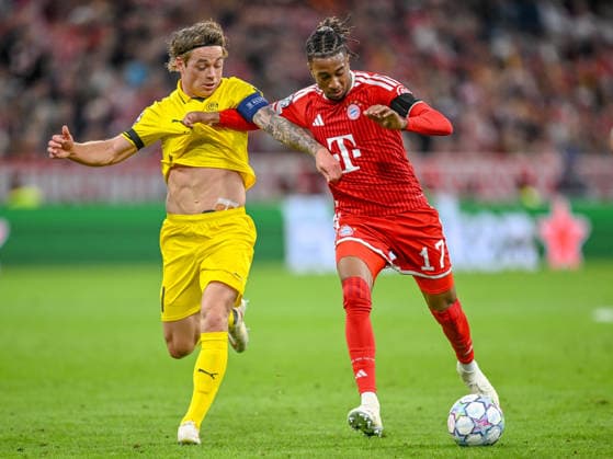 Patrick Berg of FK Bodo Glimt and Michael Olise of FC Bayern Munich battle for the ball during the 2026–2027 UEFA Champions League match between Bayern Munich and Bodo Glimt at Fussball Arena Munich on September 10, 2026 in Munich, Germany. Photo by Harry Langer, DeFodi Images