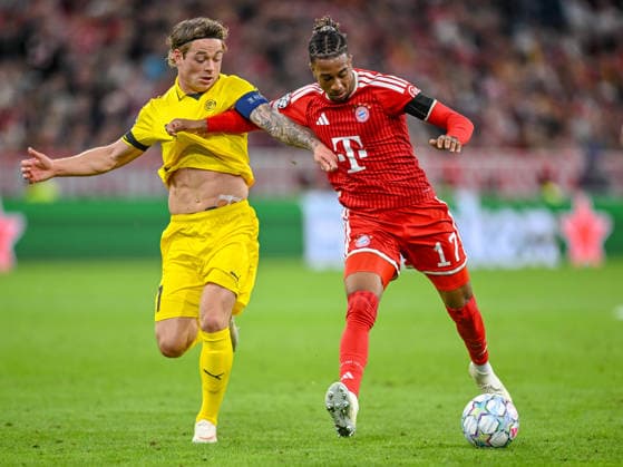 Patrick Berg of FK Bodo Glimt and Michael Olise of FC Bayern Munich battle for the ball during the 2026–2027 UEFA Champions League match between Bayern Munich and Bodo Glimt at Fussball Arena Munich on September 10, 2026 in Munich, Germany. Photo by Harry Langer, DeFodi Images