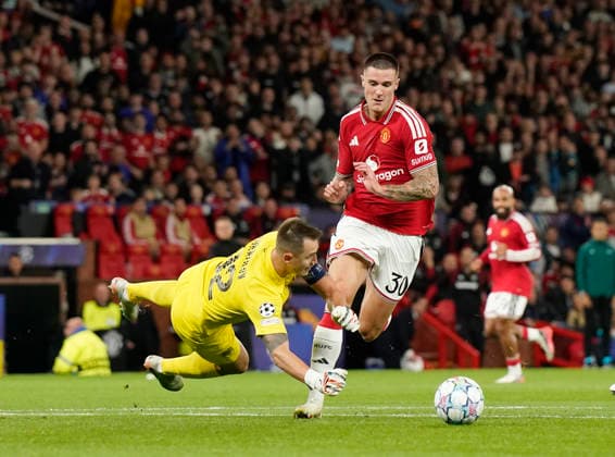 Manchester, England, 10th September 2026. Benjamin Sesko of Manchester United, ManU goes past Stas Pokatilov of Sabah FC to score the third goal during the Manchester United vs Sabah UEFA Champions League match at Old Trafford, Manchester. Picture credit should read: Andrew Yates Sportimage EDITORIAL USE ONLY. No use with unauthorised audio, video, data, fixture lists, club league logos or live services. Online in-match use limited to 120 images, no video emulation. No use in betting, games or single club league player publications. SPI_047_AY_Man_Utd_Sabah SPI-4989-0045