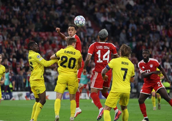 Soccer, Men s, Champions League, 2026–2027 Season, FC Bayern Munich vs. FK Bodø Glimt, Matchday 1, Allianz Arena: Jamal Musiala of FC Bayern Munich jumps to head the ball in the opponent s penalty area; game scene