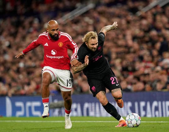 Manchester, England, 10th September 2026. Bryan Mbeumo of Manchester United, ManU challenges Tymoteusz Puchacz of Sabah FC (r) during the Manchester United vs Sabah UEFA Champions League match at Old Trafford, Manchester. Picture credit should read: Andrew Yates Sportimage EDITORIAL USE ONLY. No use with unauthorised audio, video, data, fixture lists, club league logos or live services. Online in-match use limited to 120 images, no video emulation. No use in betting, games or single club league player publications. SPI_056_AY_Man_Utd_Sabah SPI-4989-0056