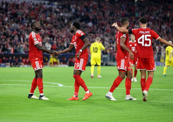 Soccer, Men s, Champions League, 2026–2027 Season, FC Bayern Munich vs. FK Bodø Glimt, Matchday 1, Allianz Arena, 3–0 (goal by Alphonso Davies of FC Bayern Munich), Dayot Upamecano of FC Bayern Munich congratulates him, goal, celebration