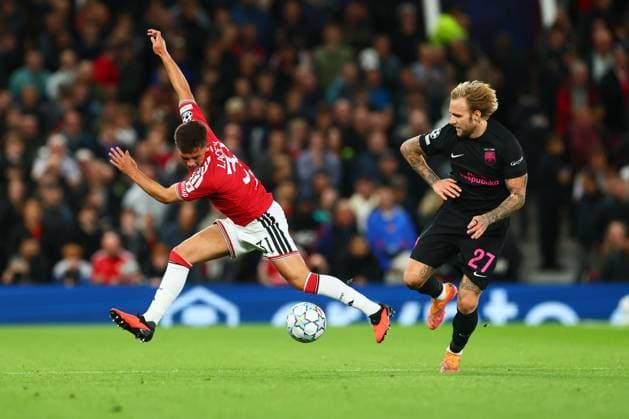 Shea Lacey of Manchester United, ManU and Tymoteusz Puchacz of Sabah Manchester United v Sabah, UEFA Champions League, Football, Old Trafford, UK - 10 Sep 2026Manchester Old Trafford United Kingdom  Copyright: xPaulxCurrie Shutterstockx 17144908bn
