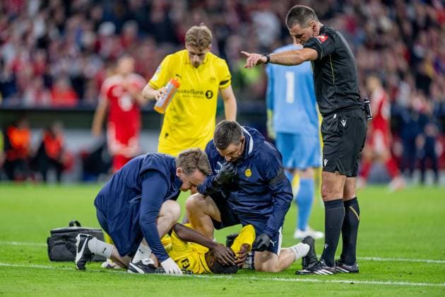 Joshua Kitolano of FK Bodo Glimt, 16, is lying injured on the ground and needs medical attention. GER, FC Bayern Munich vs. FK Bodo Glimt, Soccer, UEFA Champions League, Group Stage, Matchday 1, 2026–2027 Season, September 10, 2026 DFL DFB regulations prohibit any use of photographs as image sequences and or quasi-video. Photo: HMB Media, Heike Feiner Copyright: HMBxMedia HeikexFeiner