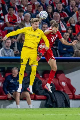 Heading duel between Jens Petter Hauge (FK Bodo Glimt, 10) and Josip Stanisic (FC Bayern Munich, 44, GER), FC Bayern Munich vs. FK Bodo Glimt, soccer, UEFA Champions League, group stage, Matchday 1, 2026–2027 season, September 10, 2026. DFL and DFB regulations prohibit any use of photographs as image sequences and or quasi-video. Photo: HMB Media, Heike Feiner Copyright: HMBxMedia HeikexFeiner