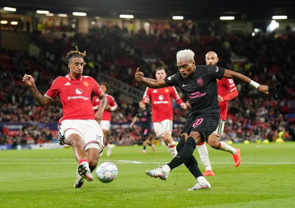 Manchester, England, 10th September 2026. Joy-Lance Mickels of Sabah FC gets in a cross past Leny Yoro of Manchester United, ManU during the Manchester United vs Sabah UEFA Champions League match at Old Trafford, Manchester. Picture credit should read: Andrew Yates Sportimage EDITORIAL USE ONLY. No use with unauthorised audio, video, data, fixture lists, club league logos or live services. Online in-match use limited to 120 images, no video emulation. No use in betting, games or single club league player publications. SPI_061_AY_Man_Utd_Sabah SPI-4989-0061