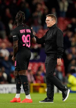 Manchester, England, 10th September 2026. Orphe Mbina of Sabah FC consoled by Valdas Dambrauskas manager of Sabah FC during the Manchester United, ManU vs Sabah UEFA Champions League match at Old Trafford, Manchester. Picture credit should read: Andrew Yates Sportimage EDITORIAL USE ONLY. No use with unauthorised audio, video, data, fixture lists, club league logos or live services. Online in-match use limited to 120 images, no video emulation. No use in betting, games or single club league player publications. SPI_065_AY_Man_Utd_Sabah SPI-4989-0066