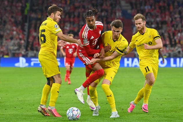 From left: Fredrik Bjoerka (Glimt), Michael Olise (Bayern Munich), Odin Bjoertuft (Glimt), Ole Didrik Blomberg (Glimt), Action, Tackle, Soccer, Champions League, 2026–27 Season, League stage: FC Bayern Munich vs. Bodo Glimt 5–0 on September 10, 2026