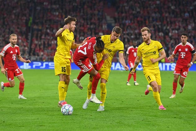 From left: Fredrik Bjoerka (Glimt), Michael Olise (Bayern Munich), Odin Bjoertuft (Glimt), Ole Didrik Blomberg (Glimt), Action, Tackle, Soccer, Champions League, 2026–27 Season, League stage: FC Bayern Munich vs. Bodo Glimt, 5–0 on September 10, 2026
