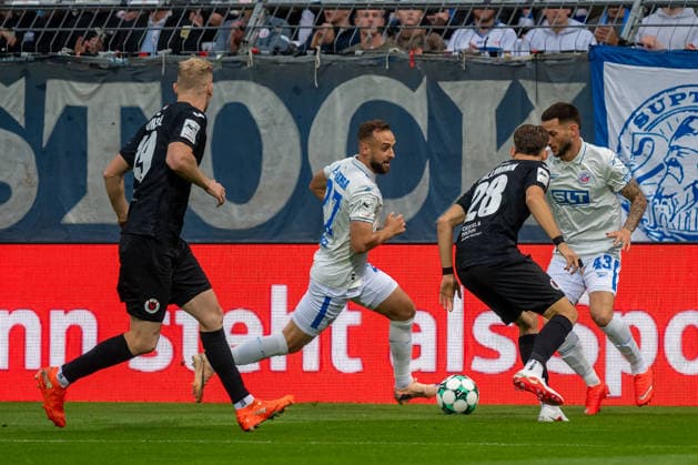 Tackle between Pascal Fallmann of Viktoria Cologne, 28, and Leon Dajaku of FC Hansa Rostock, 43, with David Kopacz of FC Hansa Rostock, 27, and Meiko Sponsel of Viktoria Cologne, 19. FC Viktoria Cologne vs. FC Hansa Rostock, soccer, 3rd League, Matchday 5, 2026–2027 season, September 11, 2026 DFL-DFB regulations prohibit any use of photographs as image sequences and or quasi-video FC Viktoria Cologne vs. FC Hansa Rostock, soccer, 3rd Division, Matchday 5, 2026–2027 season, September 11, 2026, Cologne Copyright: xEibner-Pressefoto ThomasxHaeslerx EP_THR