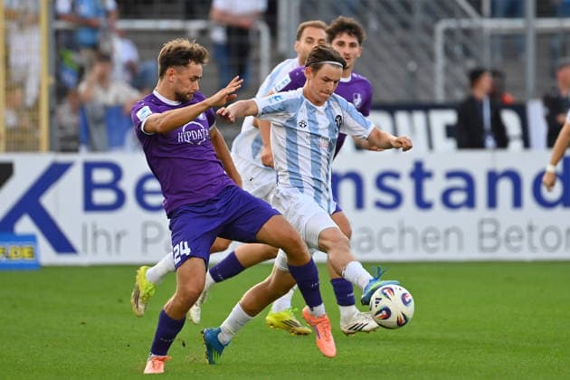 Raphael OTT, TSV 1860 Munich, Action,Tackle against Elias HERZIG, Bavarian Regional Soccer League, 2026–2027 season, Matchday 8: TSV 1860 Munich vs. Schwaben Augsburg on September 11, 2026, at Grünwalder Stadion in Munich