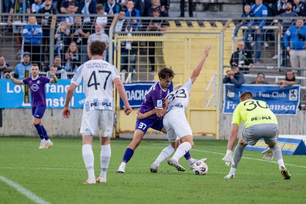 Lasse Fassmann (TSV 1860 Munich, 33) defends against Johannes Rehwald (TSV 1847 Schwaben Augsburg, 37) in front of the goal of Vitus Eicher (goalkeeper, TSV 1860 Munich, 30, GER), TSV 1860 Munich vs. TSV Schwaben Augsburg, soccer, Bavarian Regional League, Matchday 8, 2026–2027 season, September 11, 2026 DFL DFB regulations prohibit any use of photographs as image sequences and or quasi-video. Photo: HMB Media, Heike Feiner Copyright: HMBxMedia HeikexFeiner