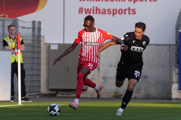 Bismark Adomah (SC Freiburg II), 33, in a tackle with Lukas Mazagg (SV Sandhausen), 21, Germany, Soccer, Regionalliga Südwest, Matchday 7, 2026–2027, SC Freiburg II vs. SV Sandhausen, September 11, 2026, Dreisamstadion, Freiburg, Dreisamstadion, Baden-Württemberg, Germany Copyright: xArnexAmbergx
