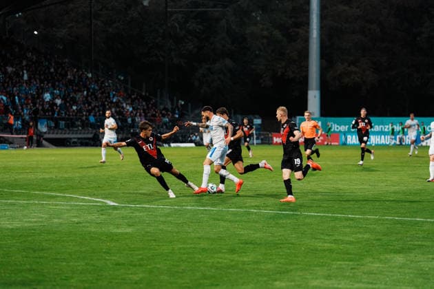 Germany, Soccer, Men s 3rd Division 2026–2027, Matchday 5: FC Viktoria Köln vs. FC Hansa Rostock—Cologne: Dribbling, possession, on the ball, build-up play, awareness, Leon Dajaku, Hansa Rostock, 43, foul by Tim Kloss, FC Viktoria Köln, 18 Copyright: xThiemoxRudolphx