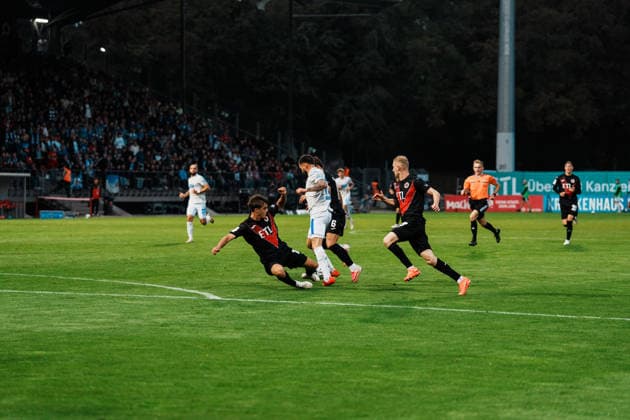 Germany, Soccer, Men s 3rd Division 2026–2027, Matchday 5: FC Viktoria Köln vs. FC Hansa Rostock—Cologne: Dribbling, possession, on the ball, build-up play, awareness, Leon Dajaku, Hansa Rostock, 43, foul by Tim Kloss, FC Viktoria Köln, 18 Copyright: xThiemoxRudolphx