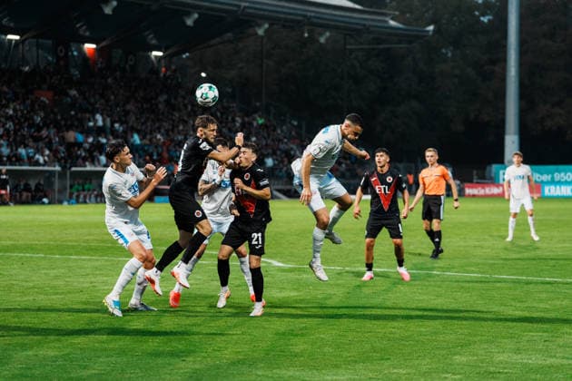 Germany, Soccer, Men s 3rd Division 2026–2027, Matchday 5: FC Viktoria Köln vs. FC Hansa Rostock—Heading duel in the penalty area: Lucas Mika Wolf (FC Viktoria Köln, 21) and Kenan Fatkic (Hansa Rostock, 4) Copyright: xThiemoxRudolphx