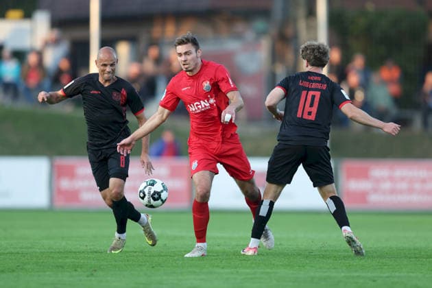September 11, 2026, Men s Soccer, 2026–2027 Season, Bavarian Regional League, Matchday 8: TSV Aubstadt vs. SpVgg Unterhaching, Max Grimm 9, TSV Aubstadt faces off against Manuel Stiefler 8, SpVgg Unterhaching, and Dominik Lindermeir 18, SpVgg Unterhaching; Sulzfeld School Stadium, Aubstadt; NGN Arena, Bavaria, Germany