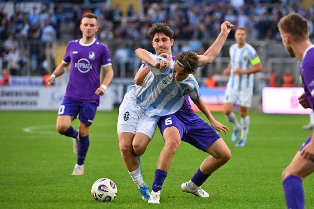 Raphael OTT, TSV 1860 Munich, Action,Tackle against Jakob KRAUSS A, Bavarian Regional Soccer League, 2026–2027 season, Matchday 8: TSV 1860 Munich vs. Schwaben Augsburg on September 11, 2026, at Grünwalder Stadion in Munich