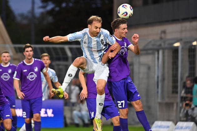 Michael EBERWEIN 1860 Munich, Action,One-on-one duel against Johannes REHWALD A in the Bavarian Regional Soccer League, 2026–2027 season, Matchday 8: TSV 1860 Munich vs. Schwaben Augsburg on September 11, 2026, at Grünwalder Stadium in Munich