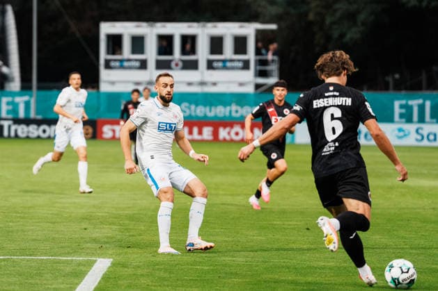 Germany, Soccer, Men s 3rd Division 2026–2027, Matchday 5: FC Viktoria Köln vs. FC Hansa Rostock, Köln Ranger Ball, Tobias Eisenhuth (FC Viktoria Köln) builds up play against David Kopacz (Hansa Rostock), 6–27 Copyright: xThiemoxRudolphx