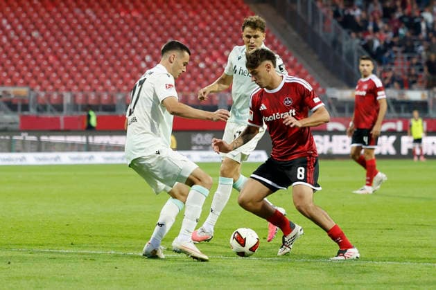 v.l.n.r.: Bastian Allgeier (Hannover 96) und Javier Fernández (1. FC Nürnberg), im 2. Bundesliga-Spiel zwischen dem 1. FC Nürnberg und Hannover 96 im Max-Morlock-Stadion, Nürnberg, Deutschland, am 11. September 2026. DFB DFL REGULATIONS PROHIBIT ANY USE OF PHOTOGRAPHS AS IMAGE SEQUENCES AND OR QUASI-VIDEO, *** From left to right: Bastian Allgeier of Hannover 96 and Javier Fernández of 1. FC Nürnberg, during the 2. Bundesliga match between 1. FC Nürnberg and Hannover 96 at Max Morlock Stadium, Nuremberg, Germany, on September 11, 2026. DFB and DFL regulations prohibit any use of photographs as image sequences and or quasi-video, Copyright: HMBxMedia xHeikoxBecker