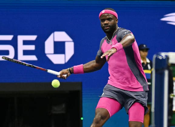 Frances Tiafoe returns a ball to Ben Shelton in the first set in the Men s Semifinal in Arthur Ashe Stadium at the 2026 US Open Tennis Championship at the USTA Billie Jean King National Tennis Center in New York City on Friday, September 11, 2026.  NYP20260911907 LARRYxMARANO