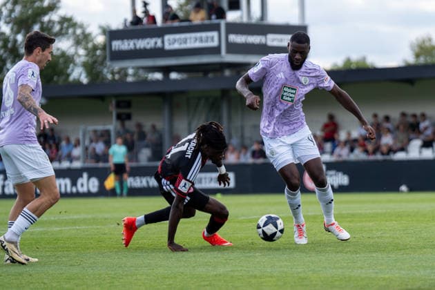 September 12, 2026, xhfmx, Regional League Southwest soccer, Eintracht Frankfurt U21 vs. FC 08 Homburg, featuring Cherif Cisse of Eintracht Frankfurt U21, No. 11 in a tackle with Aaron Manu of FC 08 Homburg, 4 Dreieich