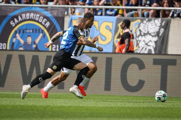 3rd Division, 2026–27 Season, Match 1: FC Saarbrücken vs. FC Ingolstadt 04, Philip Fahrner (No. 42, Saarbrücken) and Keanan Bennetts (No. 18, FCI). Photo by Jürgen Meyer. 3rd Division, 2026–27 Season, Match 1: FC Saarbrücken vs. FC Ingolstadt 04