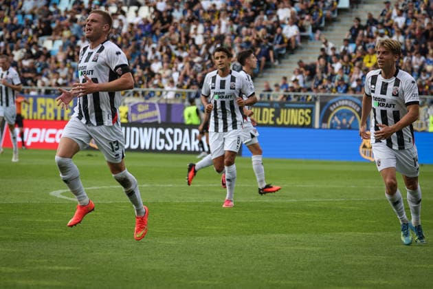 3rd Division, 2026–27 Season: 1. FC Saarbrücken vs. FC Ingolstadt 04 XXXXX XXXXX Photo by Meyer: Lars Lokotsch (No. 13, FCI) scores the opening goal (0–1); FCI celebrates. 3rd Division, 2026–27 Season: 1. FC Saarbrücken vs. FC Ingolstadt 04