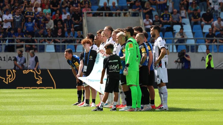 September 12, 2026, xrekx, Soccer 3rd Division, 1. FC Saarbrücken vs. FC Ingolstadt 04—both teams on the field with a Saarbrücken banner