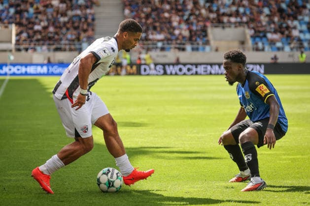 3rd Division, 2026–27 Season, Match 1: FC Saarbrücken vs. FC Ingolstadt 04; Keanan Bennetts (No. 18, FCI) and Kelsey Owusu (No. 31, Saarbrücken); Photo by Jürgen Meyer; 3rd Division, 2026–27 Season, Match 1: FC Saarbrücken vs. FC Ingolstadt 04