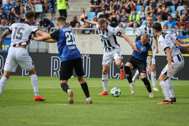 3rd Division, 2026–27 Season, Match 1: FC Saarbrücken vs. FC Ingolstadt 04, Lars Lokotsch (No. 13, FCI) vs. Philip Fahrner (No. 42, Saarbrücken). Photo by Jürgen Meyer. 3rd Division, 2026–27 Season, Match 1: FC Saarbrücken vs. FC Ingolstadt 04