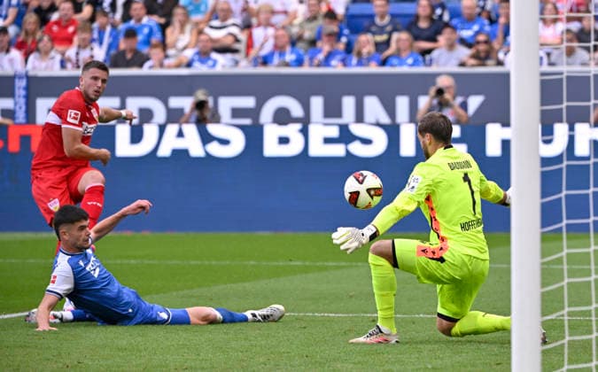 Strafraumszene, Torraumszene Torschuss Aktion Torchance Ermedin Demirovic VfB Stuttgart (09) gegen Albian Hajdari TSG 1899 Hoffenheim (21) Torwart Oliver Baumann TSG 1899 Hoffenheim (01) TSG 1899 Hoffenheim vs VfB Stuttgart 12.09.2026 DFL REGULATIONS PROHIBIT ANY USE OF PHOTOGRAPHS AS IMAGE SEQUENCES AND OR QUASI-VIDEO TSG 1899 Hoffenheim vs VfB Stuttgart *** Penalty area scene, Goalmouth action, shot on goal, scoring opportunity: Ermedin Demirovic (VfB Stuttgart 09) vs. Albian Hajdari (TSG 1899 Hoffenheim 21); goalkeeper Oliver Baumann (TSG 1899 Hoffenheim 01); TSG 1899 Hoffenheim vs. VfB Stuttgart September 12, 2026 DFL regulations prohibit any use of photographs as image sequences and or quasi-video TSG 1899 Hoffenheim vs. VfB Stuttgart