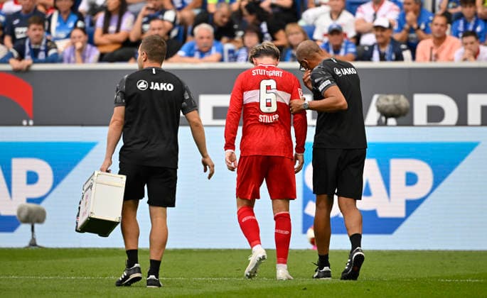 Angelo Stiller VfB Stuttgart (06) verletzt Verletzung am Boden Vereinsarzt Dr. Raymond Best VfB Stuttgart muss vom Platz TSG 1899 Hoffenheim vs VfB Stuttgart 12.09.2026 DFL REGULATIONS PROHIBIT ANY USE OF PHOTOGRAPHS AS IMAGE SEQUENCES AND OR QUASI-VIDEO TSG 1899 Hoffenheim vs VfB Stuttgart *** Angelo Stiller, VfB Stuttgart 06, injured; lying on the ground; club doctor Dr. Raymond Best, VfB Stuttgart, must leave the field; TSG 1899 Hoffenheim vs. VfB Stuttgart, September 12, 2026; DFL regulations prohibit any use of photographs as image contentQUENCES AND OR QUASI-VIDEO TSG 1899 Hoffenheim vs. VfB Stuttgart