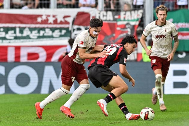 1. Fussball Bundesliga: FC Augsburg - Bayer 04 Leverkusen, 12.09.2026 AUGSBURG, GERMANY; 12. SEPTEMBER: im Duell Fabian RIEDER (FC Augsburg 32) und Ibrahim MAZA (Bayer Leverkusen 30) während dem Match der Bundesliga zwischen dem FC Augsburg und Bayer 04 Leverkusen am 3. Spieltag in der WWK-Arena DFL REGULATIONS PROHIBIT ANY USE OF PHOTOGRAPHS AS IMAGE SEQUENCES AND OR QUASI-VIDEO *** 1 Soccer Bundesliga FC Augsburg vs. Bayer 04 Leverkusen, September 12, 2026, AUGSBURG, GERMANY, September 12: A duel between Fabian RIEDER (FC Augsburg, 32) and Ibrahim MAZA (Bayer Leverkusen, 30) during the Bundesliga match between FC Augsburg and Bayer 04 Leverkusen on Matchday 3 at the WWK Arena. DFL REGULATIONS PROHIBIT ANY USE OF PHOTOGRAPHS AS IMAGE SEQUENCES AND OR QUASI-VIDEO Copyright: xBEAUTIFULxSPORTS Goldbergx