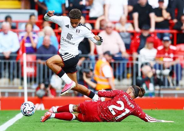 Josh King of Fulham and Kostas Tsimikas of Liverpool Liverpool v Fulham, Premier League, Football, Football, Anfield, Liverpool, UK - 12 Sep 2026Liverpool Anfield United Kingdom EDITORIAL USE ONLY No use with unauthorised audio, video, data, fixture lists, club league logos or live services. Online in-match use limited to 120 images, no video emulation. No use in betting, games or single club league player publications.  Copyright: xMattxWest Shutterstockx 17144551av