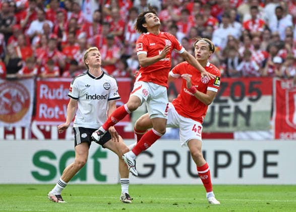 Fussball-Bundesliga - Saison 2026 2027 Mewa-Arena Mainz - 12.09.2026 1. FSV Mainz 05 (mz) - Eintracht Frankfurt (f) V.li: Jonathan BURKARDT (Eintracht Frankfurt), Kaishu SANO (1. FSV Mainz 05), Kacper POTULSKI (mz) DFL REGULATIONS PROHIBIT ANY USE OF PHOTOGRAPHS AS IMAGE SEQUENCES AND OR QUASI VIDEO EDITORIAL USE ONLY NATIONAL AND INTERNATIONAL NEWS AGENCIES OUT Fussball-Bundesliga - 1. FSV Mainz 05 *** German Bundesliga 2026–2027 Season, Mewa Arena, Mainz, September 12, 2026, 1:00 p.m. FSV Mainz 05 vs. Eintracht Frankfurt. From left to right: Jonathan BURKARDT (Eintracht Frankfurt), Kaishu SANO (FSV Mainz 05), Kacper POTULSKI mz DFL regulations prohibit any use of photographs as image sequences and or quasi-video; editorial use only; national and international news agencies excluded. German Bundesliga 1 FSV Mainz 05