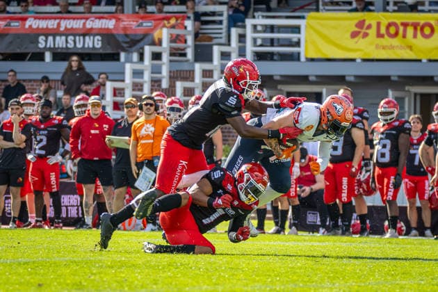 Tim Müller (ifm Razorbacks Ravensburg, 87 Wide Receiver) tackled by Ronaldo Tomasello (Potsdam Royals, 01 Defensive Back) and Aashari Crosswell (Potsdam Royals, 16 Defensive Back) Potsdam Royals vs ifm Razorbacks Ravensburg, American Football, German Football League, Week 19, 2026, 12.09.2026, Potsdam Sportpark Luftschiffhafen Brandenburg Germany Copyright: xPFA SebastianxJustx