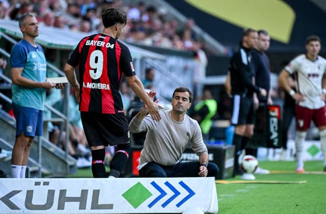 12.09.2026, xemx, Fussball 1.Bundesliga, FC Augsburg - Bayer 04 Leverkusen v.l. Afonso Moreira (Bayer 04 Leverkusen), Cheftrainer Carles Martinez (Bayer 04 Leverkusen) (DFL DFB REGULATIONS PROHIBIT ANY USE OF PHOTOGRAPHS as IMAGE SEQUENCES and or QUASI-VIDEO) Augsburg *** September 12, 2026, xemx, Soccer, Bundesliga 1, FC Augsburg vs. Bayer 04 Leverkusen, Afonso Moreira (Bayer 04 Leverkusen), Head Coach Carles Martinez (Bayer 04 Leverkusen). DFL and DFB regulations prohibit any use of photographs as image sequences and or quasi-video. Augsburg