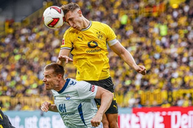 DORTMUND - Nico Schlotterbeck of Borussia Dortmund heads the ball with Steffen Tigges of SC Paderborn 07 during the Bundesliga match between Borussia Dortmund and SC Paderborn 07 at Signal Iduna Park on 12 September 2026 in Dortmund, Germany. MARCEL TER BALS ANP Bundesliga 2026 27 xVIxANPxSportx xMarcelxterxBalsxIVx 568306041 originalFilename: 568306041.jpg