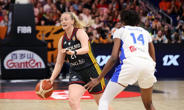 Marie Gülich with the ball, Dominique Malonga in a one-on-one matchup; game action; sports; basketball; FIBA World Cup; World Championship; Women s World Championship; semifinals; 2026–2027 season; December 9, 2026; France (FRA) vs. DBB Germany (GER)