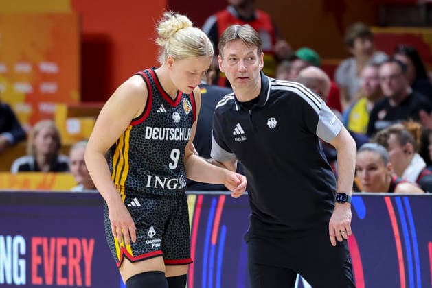 Emma Eichmeyer of Germany and national team coach Olaf Lange of Germany talk during the FIBA Women s Basketball World Cup Germany 2026 semifinal match between France and Germany at the Berlin Arena on September 12, 2026, in Berlin, Germany. Photo by Marco Steinbrenner, DeFodi Images
