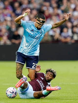 Birmingham, England, 12th September 2026. Daniel Munoz of Nottingham Forest tackled by Ibrahim Mbaye of Aston Villa during the Aston Villa vs Nottingham Forest Premier League match at Villa Park, Birmingham. Picture credit should read: Andrew Yates Sportimage EDITORIAL USE ONLY. No use with unauthorised audio, video, data, fixture lists, club league logos or live services. Online in-match use limited to 120 images, no video emulation. No use in betting, games or single club league player publications. SPI_023_AY_Villa_Forest SPI-4990-0023