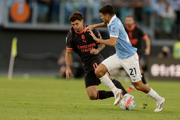 Serie A football match SS Lazio vs Ac Milan Milan™s American forward Christian Pulisic challenges for the ball with lazio™s Moroccan midfielder Reda Belahyane during the Serie A football match SS Lazio vs AC Milan at Olimpico Stadium on September 12, 2026, in Rome. _BPH7262 Copyright: xAntonioxBalascox