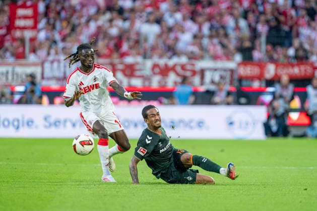 Gideon Mensah (1.FC Koeln, 14) im Zweikampf mit Arthur (SV Werder Bremen, 13) der den Ball beim graetschen passt 1.FC Köln vs. SV Werder Bremen, Fussball, Bundesliga, 3.Spieltag, Saison 2026 27, 12.09.2026, DFL REGULATIONS PROHIBIT ANY USE OF PHOTOGRAPHS AS IMAGE SEQUENCES AND OR QUASI-VIDEO, 1.FC Köln vs. SV Werder Bremen, Fussball, Bundesliga, 3.Spieltag, Saison 2026 27, 12.09.2026 Köln *** Gideon Mensah of 1. FC Köln, No. 14, in a tackle with Arthur of SV Werder Bremen, No. 13, who passes the ball while sliding, 1. FC Köln vs. SV Werder Bremen, Soccer, Bundesliga, Matchday 3, 2026–27 season, September 12, 2026, DFL regulations prohibit any use of photographs as image sequences and or quasi-video, 1. FC Köln vs. SV Werder Bremen, soccer, Bundesliga, Matchday 3, 2026–27 season, September 12, 2026, Cologne Copyright: xEibner-Pressefoto LukasxBaldygax EP_LBA