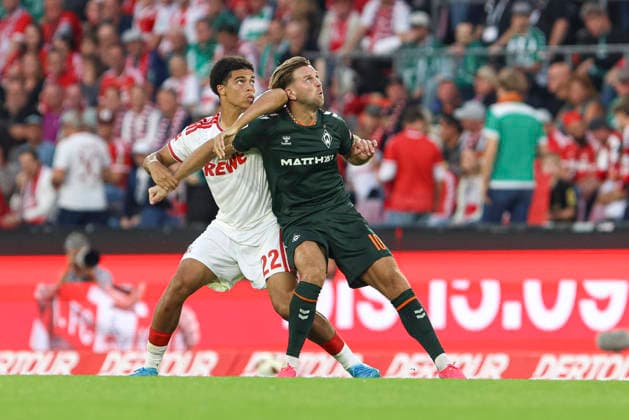 Jahmai Simpson-Pusey (1. FC Koeln) und Niclas Fuellkrug (SV Werder Bremen) im Zweikampf waehrend des Spiels der 1. Bundesliga zwischen 1. FC Koeln und SV Werder Bremen, RheinEnergieStadion am 12. September 2026 in Koeln, Deutschland. (Foto von Oliver Kaelke DeFodi Images) +++ Jahmai Simpson-Pusey (1. FC Koeln) und Niclas Fuellkrug (SV Werder Bremen) battle for the ball during the Bundesliga match between 1. FC Koeln and SV Werder Bremen at RheinEnergieStadion on September 12, 2026 in Cologne, Germany. (Photo by Oliver Kaelke DeFodi Images) DFB DFL REGULATIONS PROHIBIT ANY USE OF PHOTOGRAPHS AS IMAGE SEQUENCES AND OR QUASI-VIDEO. (Photo by Oliver Kaelke DeFodi Images) - *** Jahmai Simpson Pusey of 1. FC Köln and Niclas Füllkrug of SV Werder Bremen battle for the ball during the Bundesliga match between 1. FC Köln and SV Werder Bremen at RheinEnergieStadion on September 12, 2026, in Cologne, Germany Photo by Oliver Kaelke, DeFodi Images Jahmai Simpson Pusey of 1. FC Köln and Niclas Füllkrug of SV Werder Bremen battle for the ball during the Bundesliga match between 1. FC Köln and SV Werder Bremen at RheinEnergieStadion on September 12, 2026 in Cologne, Germany. Photo by Oliver Kaelke, DeFodi Images. DFB and DFL regulations prohibit any use of photographs as image sequences and or quasi-video. Photo by Oliver Kaelke, DeFodi Images