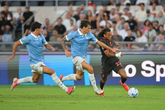 IPA88449236 - Diego Moreira of Milan under pressure from Romano Floriani of Lazio during the UEFA Champions League soccer match between Lazio and Milan at the Stadio Olimpico on September 12, 2026, in Lazio, Milan. During the SS Lazio vs. AC Milan Italian Serie A soccer match in Rome, Italy, on September 12, 2026  Copyright: xRobertoxRamaccia IPAxSportx xx IPA88449236